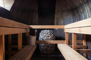 How to Choose Between an Electric vs. Wood Stove Traditional Sauna Heater